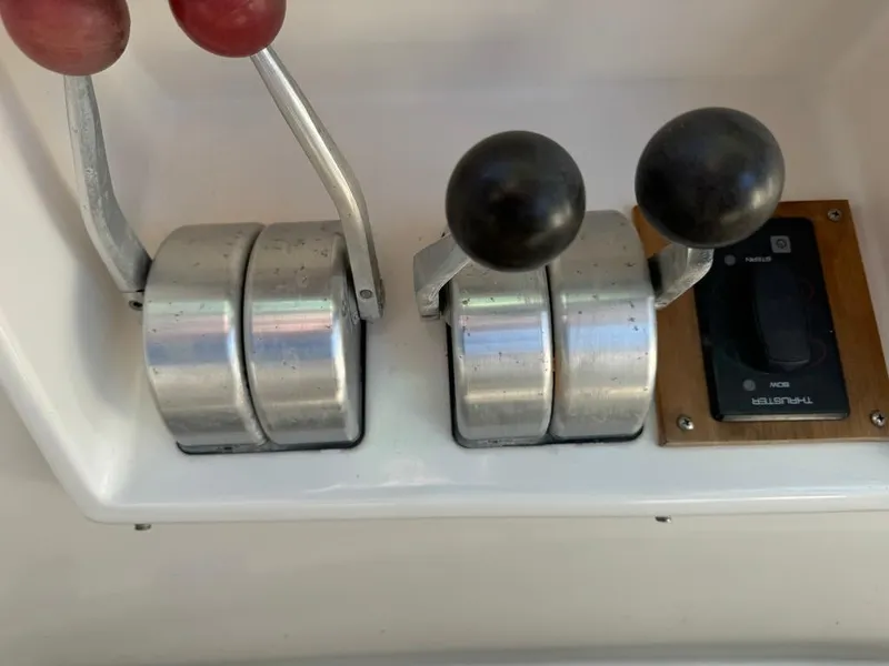 Slide: The Image of Control levers on a 1997 McKinna 48 Pilothouse yacht dashboard. - 39