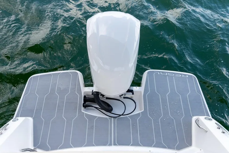 Slide: The Image of Manufacturer Provided Image: 2026 Regal 26 XO boat stern with motor on water. - 10