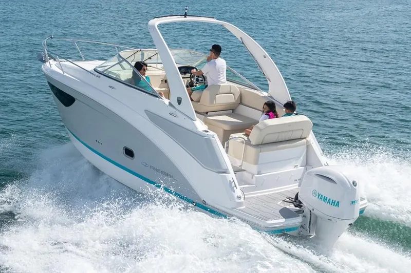 Slide: The Image of Manufacturer Provided Image: 2026 Regal 26 XO boat cruising on water with Yamaha outboard engine. - 2