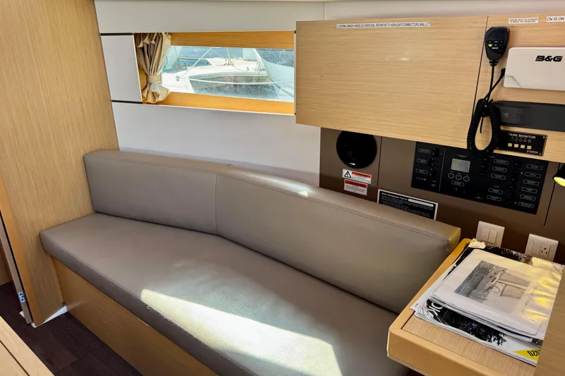 Slide: The Image of Interior of 2018 Beneteau Oceanis 35.1 yacht with seating and control panel. - 24