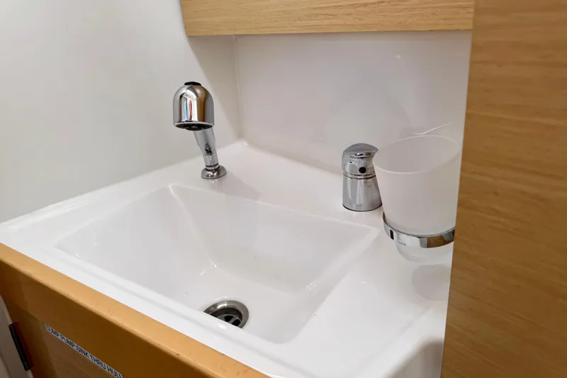 Slide: The Image of Compact sink area in 2018 Beneteau Oceanis 35.1 yacht bathroom. - 30