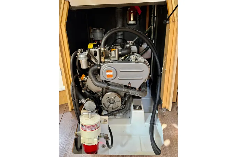 Slide: The Image of Engine compartment of a 2018 Beneteau Oceanis 35.1 sailboat, showcasing mechanical components. - 35