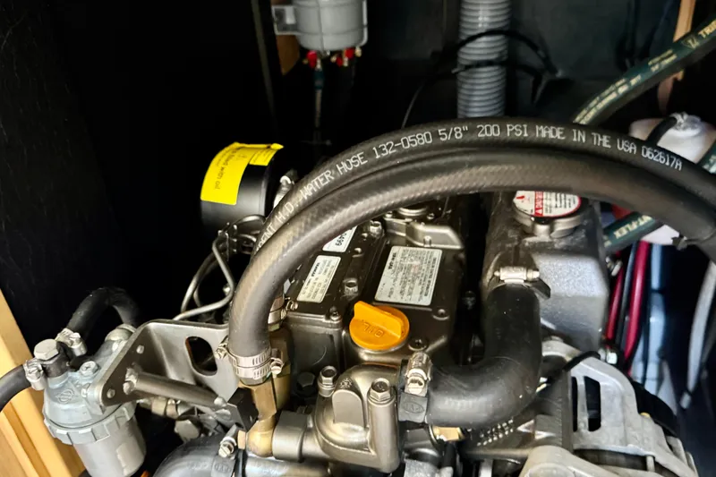 Slide: The Image of Engine compartment of a 2018 Beneteau Oceanis 35.1 sailboat, showcasing detailed components. - 36