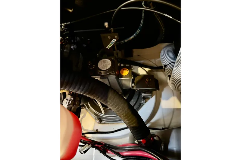 Slide: The Image of Engine compartment of a 2018 Beneteau Oceanis 35.1 sailboat, showcasing mechanical components. - 38