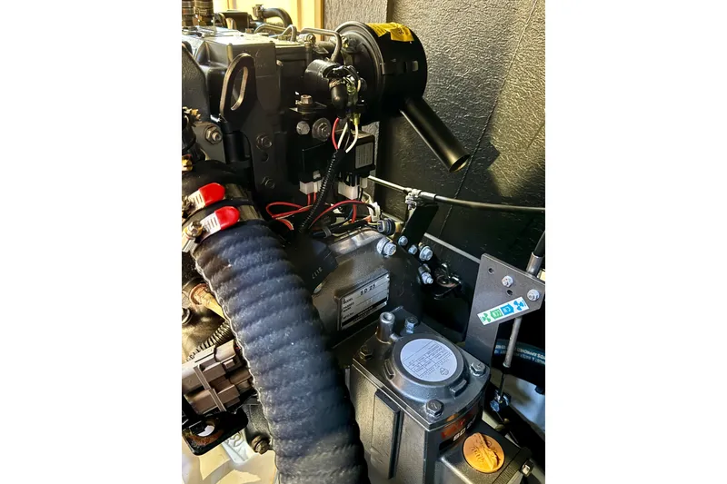 Slide: The Image of Engine compartment of 2018 Beneteau Oceanis 35.1 sailboat, showcasing mechanical components. - 39