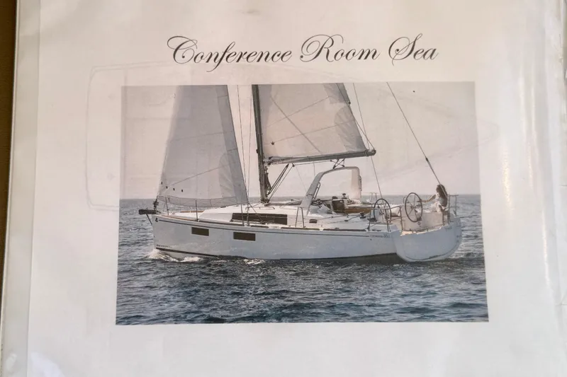 Slide: The Image of 2018 Beneteau Oceanis 35.1 sailboat on open sea, titled "Conference Room Sea". - 42