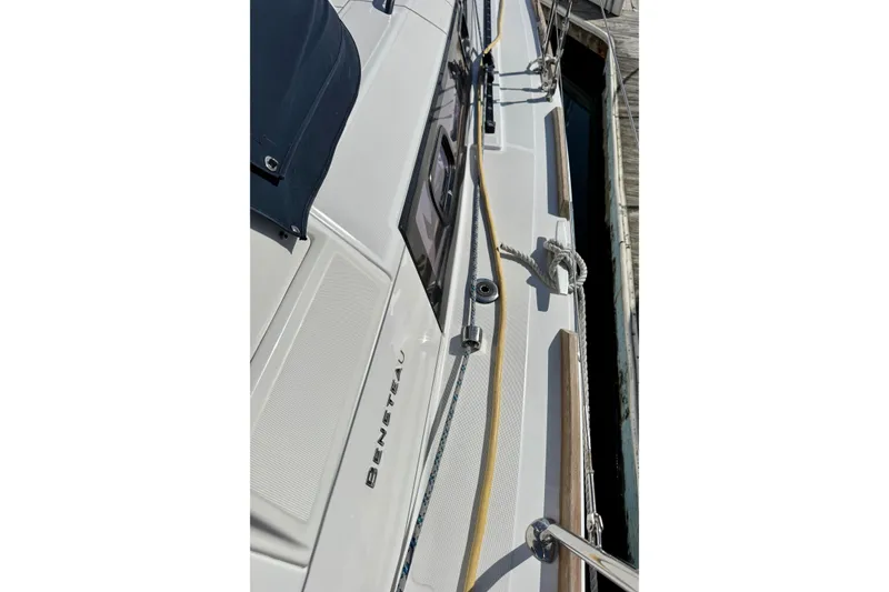 Slide: The Image of 2018 Beneteau Oceanis 35.1 sailboat deck view, showcasing sleek design and rigging details. - 58