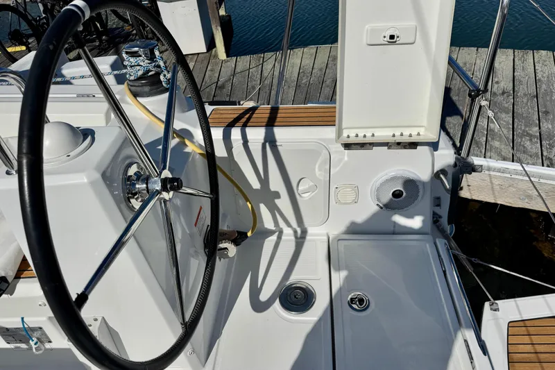 Slide: The Image of Cockpit of 2018 Beneteau Oceanis 35.1 sailboat with steering wheel and deck details. - 69