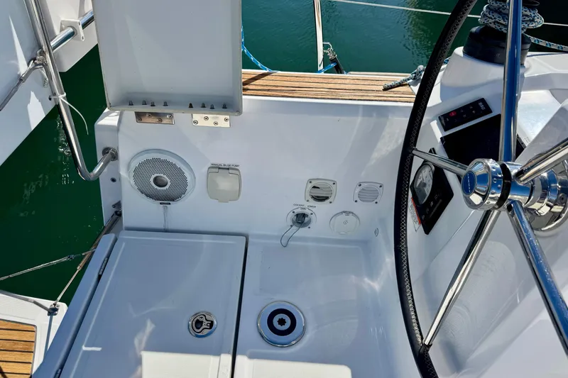 Slide: The Image of Cockpit of 2018 Beneteau Oceanis 35.1 sailboat with steering wheel and control panel. - 71