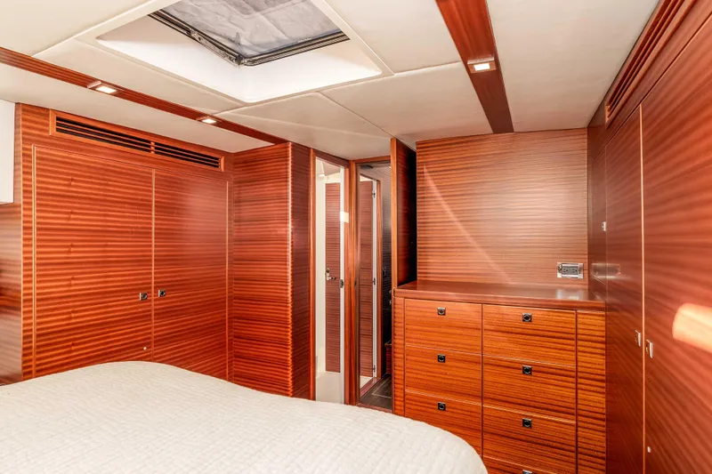 Slide: The Image of Luxurious wood-paneled cabin interior of 2021 Outback Yachts 50, featuring ample storage. - 10