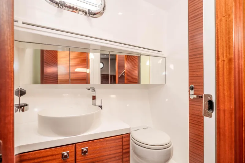 Slide: The Image of Luxurious bathroom in 2021 Outback Yachts 50, featuring modern fixtures and elegant wood accents. - 11