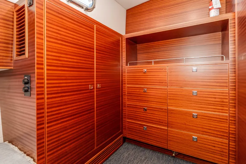 Slide: The Image of Luxurious wooden cabinetry inside a 2021 Outback Yachts 50 model. - 14