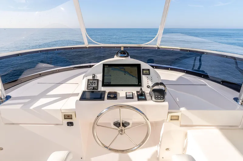 Slide: The Image of Helm of 2021 Outback Yachts 50 with navigation equipment, overlooking the ocean. - 15
