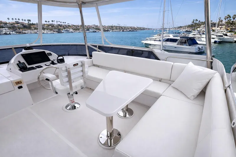 Slide: The Image of Luxurious 2021 Outback Yachts 50 interior with white seating and ocean view. - 16