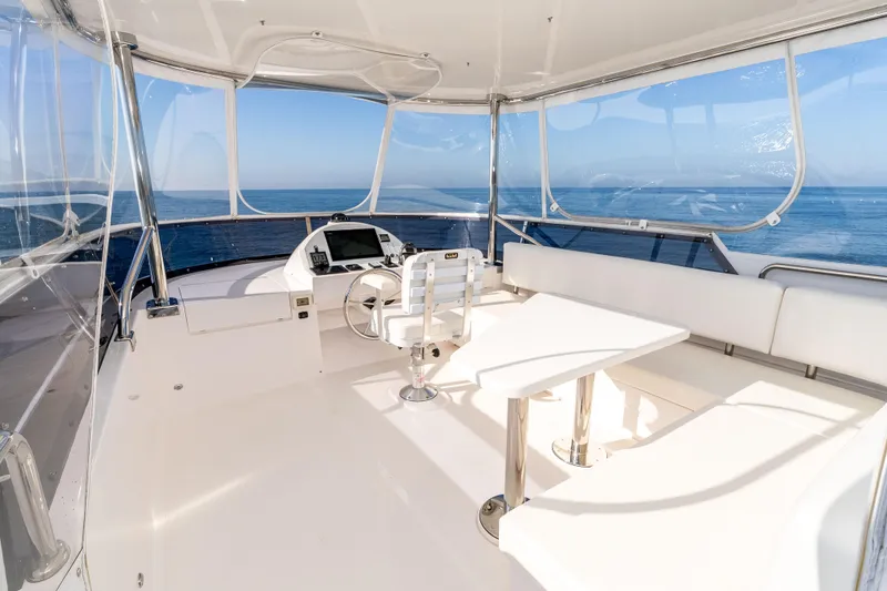 Slide: The Image of Luxurious 2021 Outback Yachts 50 interior with ocean view and modern helm. - 17