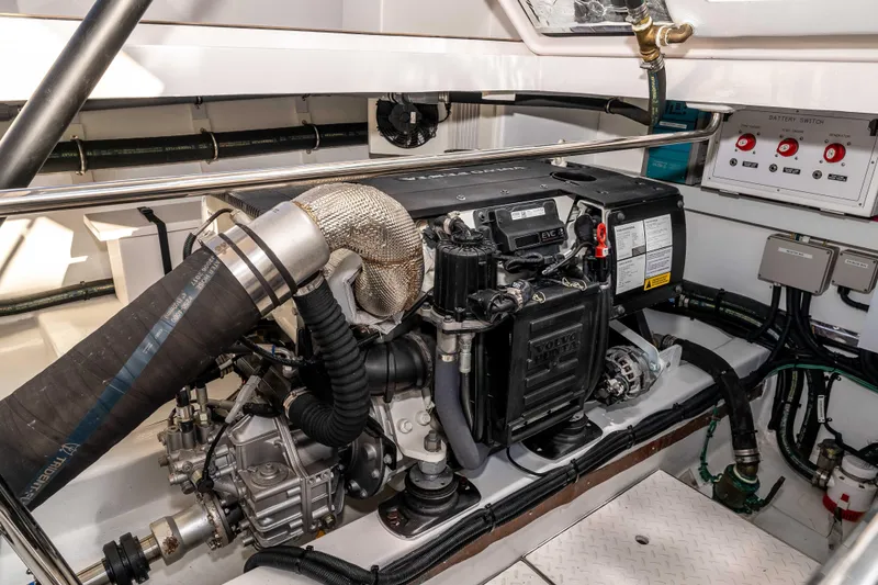 Slide: The Image of Engine room of 2021 Outback Yachts 50, featuring Volvo Penta engine and control systems. - 22