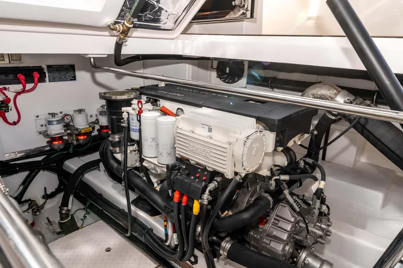 Slide: The Image of Engine room of 2021 Outback Yachts 50, showcasing detailed mechanical components and systems. - 23