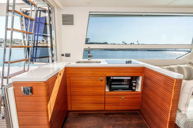 Slide: The Image of Luxurious interior of 2021 Outback Yachts 50, featuring modern kitchen with ocean view. - 4