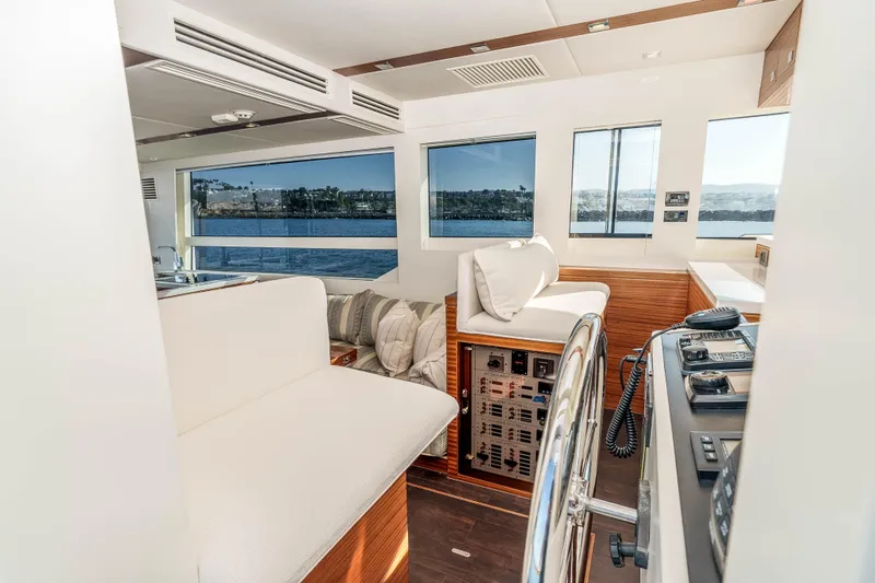 Slide: The Image of Luxurious interior of 2021 Outback Yachts 50 with panoramic windows and modern helm. - 7