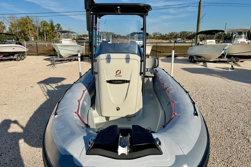 Slide: The Image of 2019 Zodiac Open 5.5 inflatable boat displayed outdoors on gravel lot. - 17