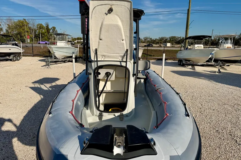 Slide: The Image of 2019 Zodiac Open 5.5 boat displayed outdoors, surrounded by other boats. - 18