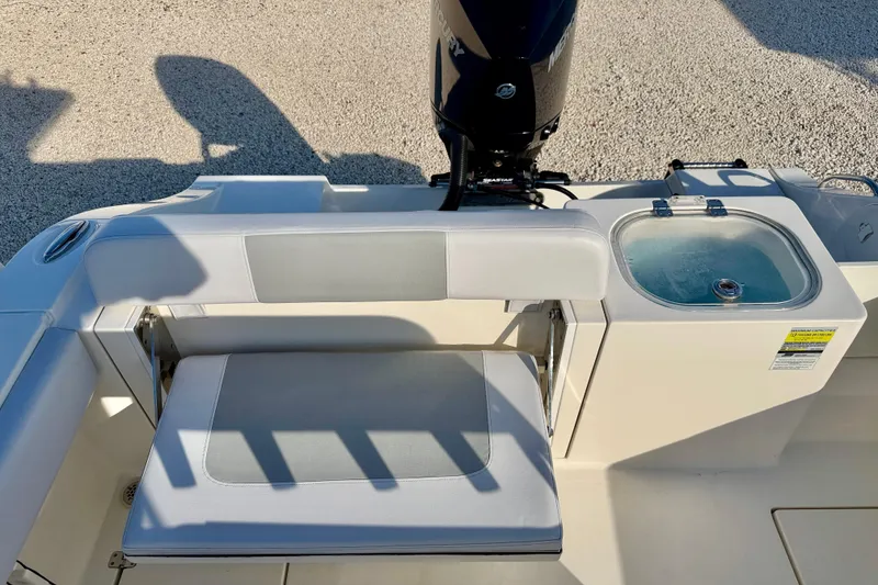 Slide: The Image of 2021 Cobia 237 Center Console boat with seating and livewell. - 22