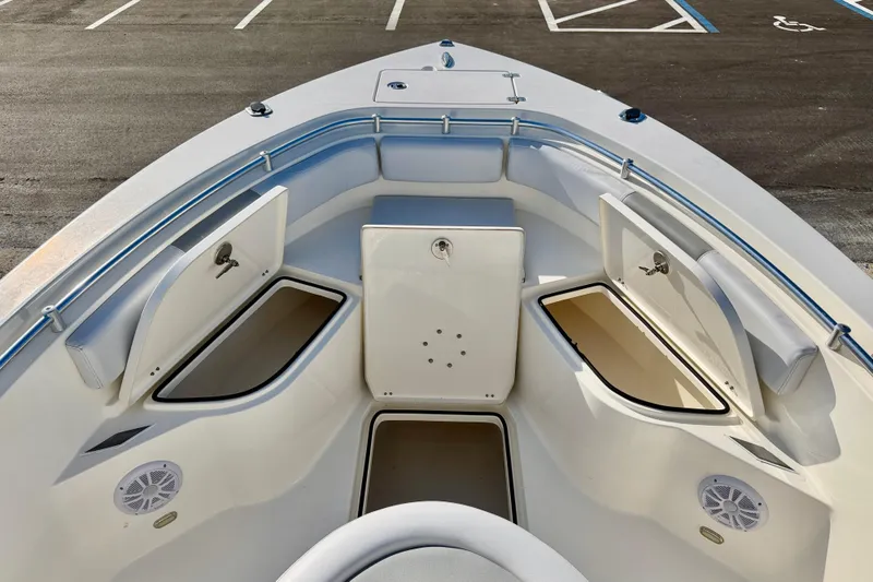 Slide: The Image of 2021 Cobia 237 Center Console boat interior with open storage compartments. - 28