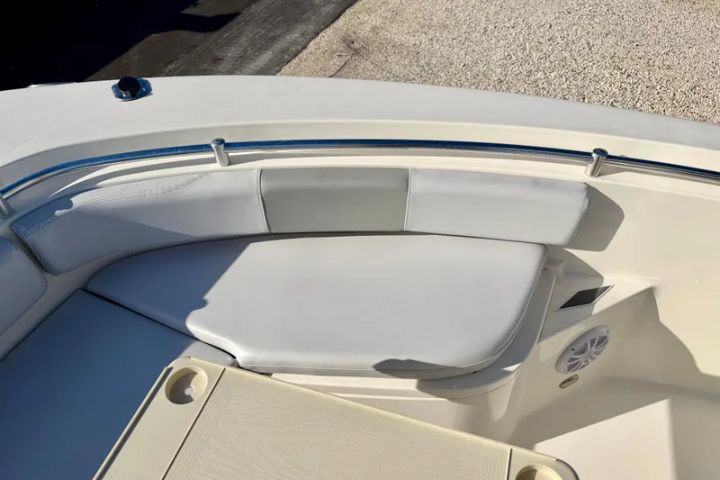 Slide: The Image of 2021 Cobia 237 Center Console boat interior with cushioned seating and speaker. - 30
