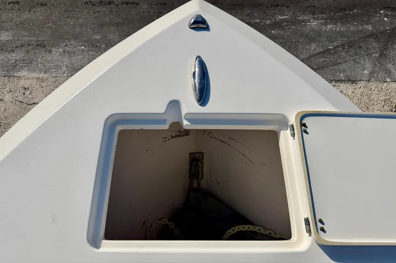 Slide: The Image of 2021 Cobia 237 Center Console anchor locker with open hatch. - 33