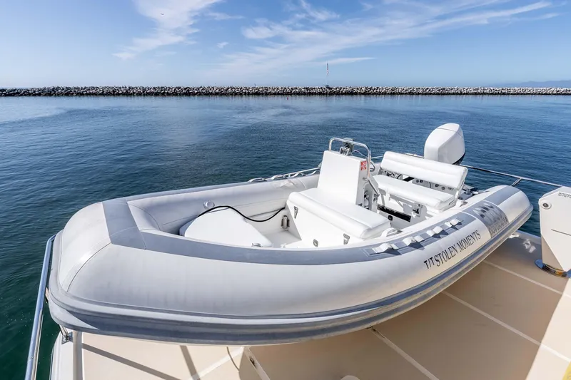 Slide: The Image of Inflatable boat on 2000 Offshore Yachts Flushdeck, docked by calm waters. - 26