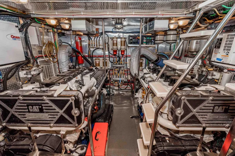 Slide: The Image of Engine room of a 2000 Offshore Yachts Flushdeck, featuring dual CAT marine engines. - 40