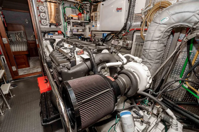 Slide: The Image of Engine room of a 2000 Offshore Yachts Flushdeck, showcasing detailed mechanical components. - 41