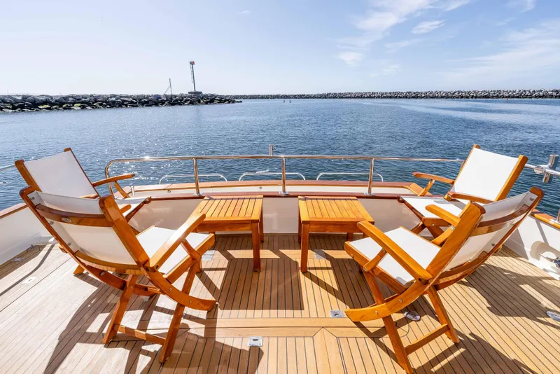 Slide: The Image of Luxurious 2000 Offshore Yachts Flushdeck with elegant deck seating and ocean view. - 6