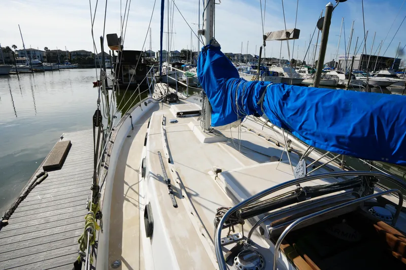 Slide: The Image of 1975 Westsail 32 sailboat docked in marina, blue sail cover, sunny day. - 7