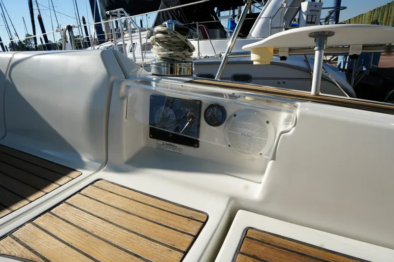 Slide: The Image of Cockpit of 2007 Beneteau 373 sailboat with teak flooring and navigation instruments. - 11