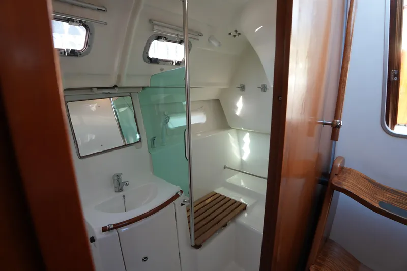 Slide: The Image of Interior of 2007 Beneteau 373 yacht bathroom with shower and sink. - 23