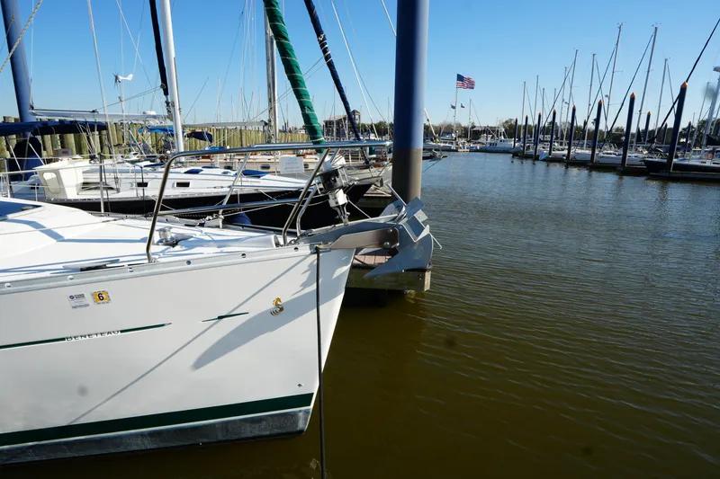 Slide: The Image of Sailboat Beneteau 373, 2007 model, docked in a marina with clear blue sky. - 5
