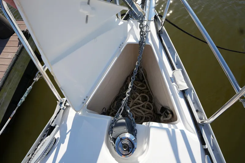 Slide: The Image of Bow of 2007 Beneteau 373 sailboat with anchor chain and rope storage. - 6