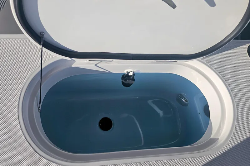 Slide: The Image of Open hatch on Jupiter 26 boat, 2026 model, showing interior compartment. - 18