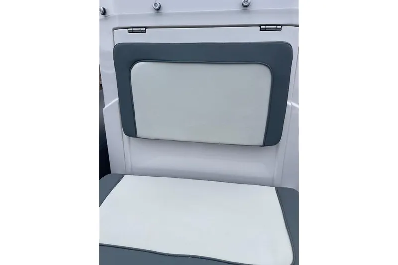 Slide: The Image of 2019 Highfield 640 Deluxe boat seat with white and gray upholstery. - 19