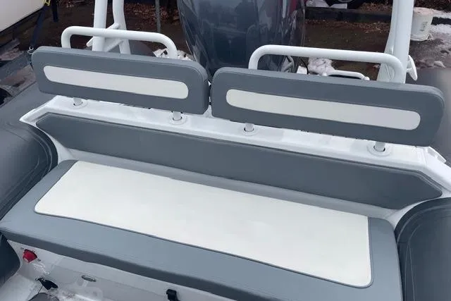 Slide: The Image of 2019 Highfield 640 Deluxe boat seating, featuring gray and white cushioned benches. - 20