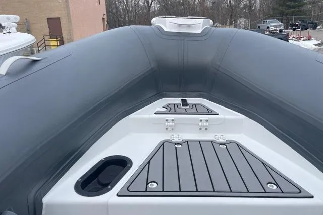 Slide: The Image of 2019 Highfield 640 Deluxe boat interior with sleek gray and white design. - 26
