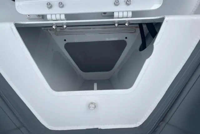 Slide: The Image of Open storage compartment of 2019 Highfield 640 Deluxe boat, showcasing interior space. - 28