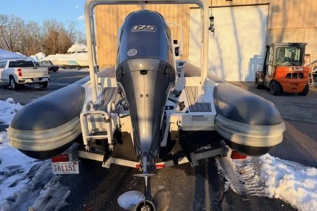 Slide: The Image of 2019 Highfield Patrol 660 boat with 175 HP engine, parked outdoors in snowy setting. - 4