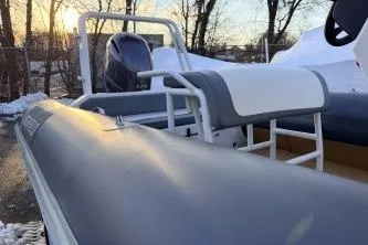 Slide: The Image of 2019 Highfield Patrol 660 boat, outdoor view, sunset background, winter setting. - 7