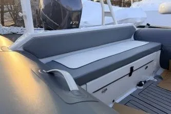 Slide: The Image of 2019 Highfield Patrol 660 boat with cushioned seating and 175 horsepower engine. - 8