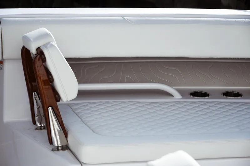 Slide: The Image of Luxury seating on a 2026 Jupiter 30 boat with elegant white upholstery. - 8