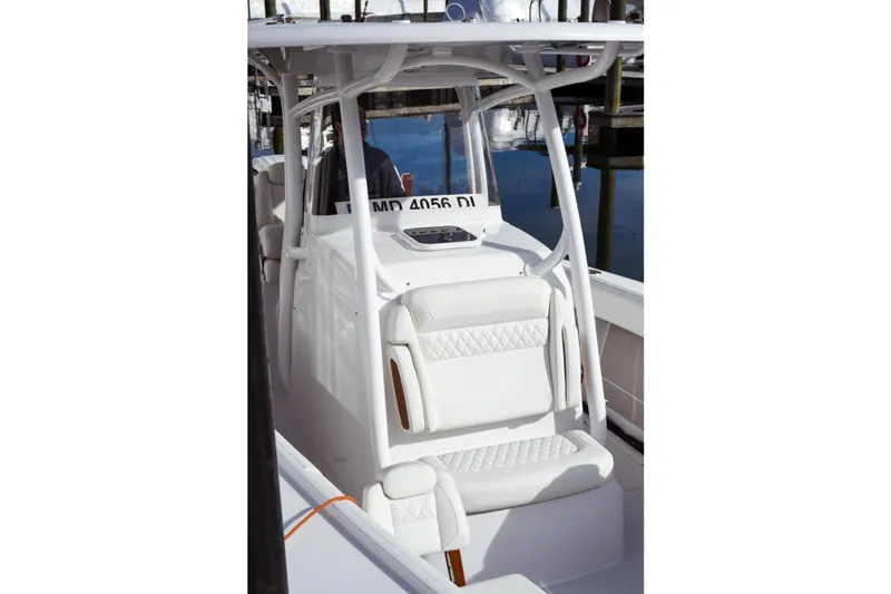 Slide: The Image of 2026 Jupiter 30 boat interior with white seating and sleek design. - 9