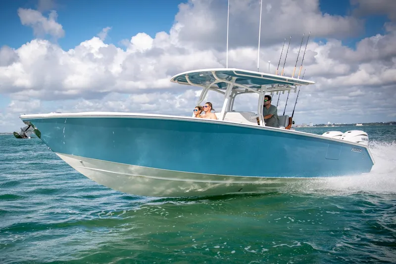 The Image of Manufacturer Provided Image: 2026 Jupiter 34 boat cruising on open water under a partly cloudy sky. - 0