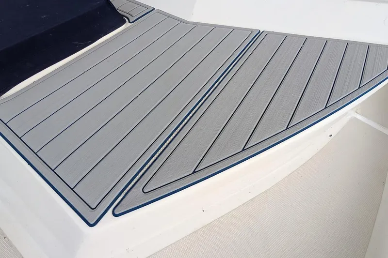 Slide: The Image of 1987 DeFever Trawler deck with sleek, modern gray non-slip surface. - 4